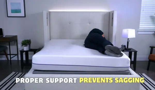 A person lying on a Purple mattress demonstrating the importance of proper foundation support to prevent mattress sagging.